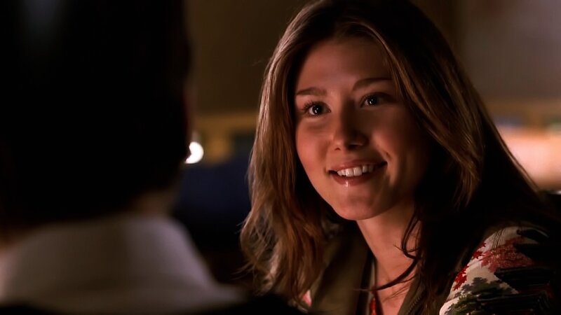 Woman Smiling at Person