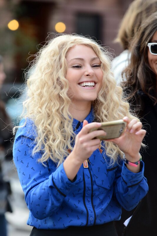 woman smiling at phone