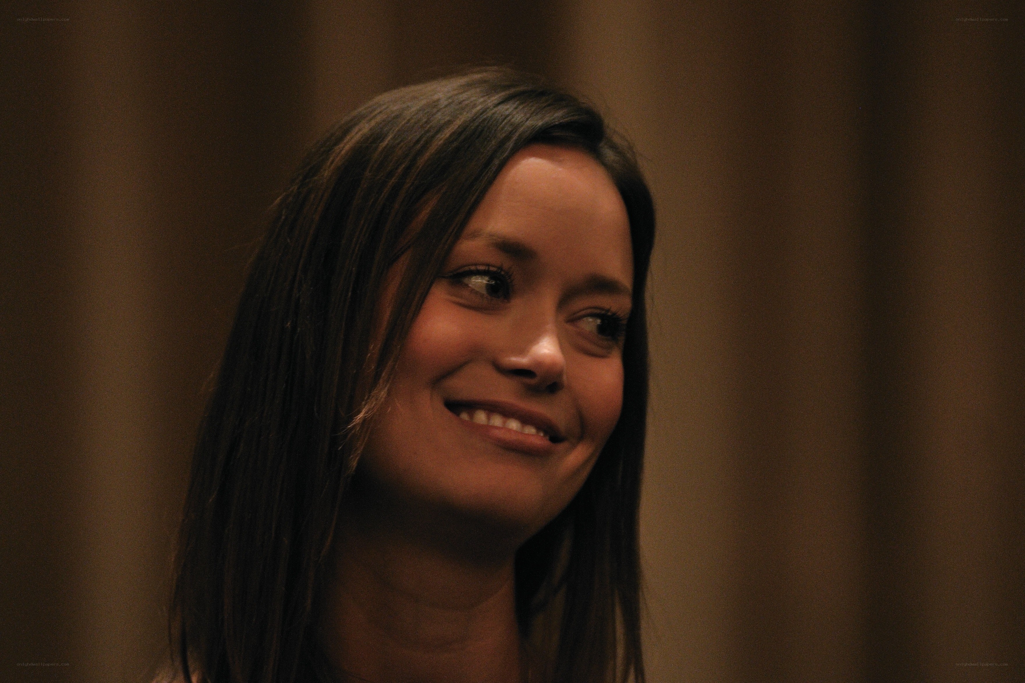 woman smiling at side