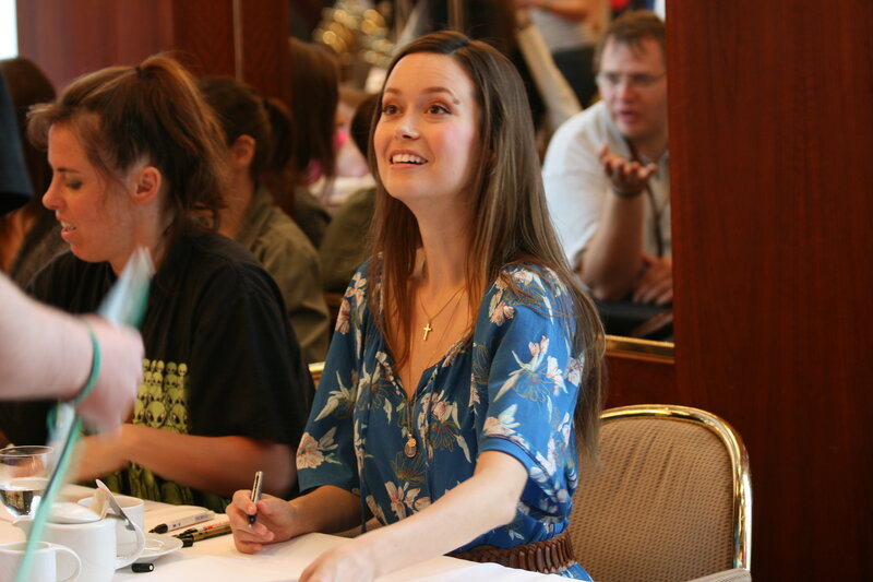 woman smiling at signing event