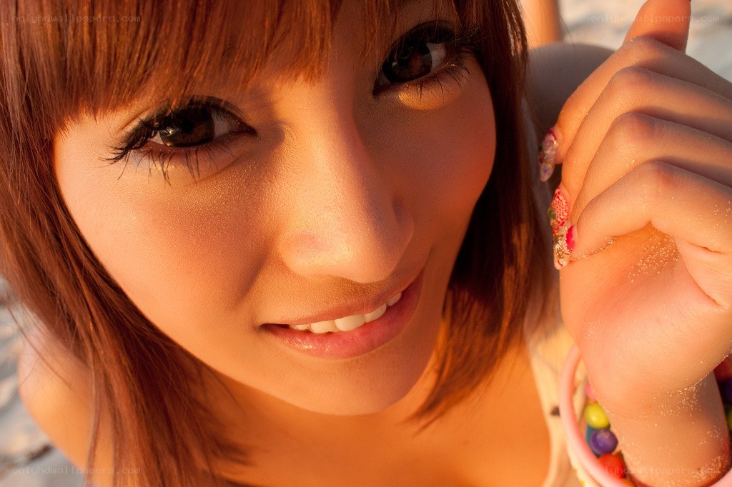 woman smiling at sunset