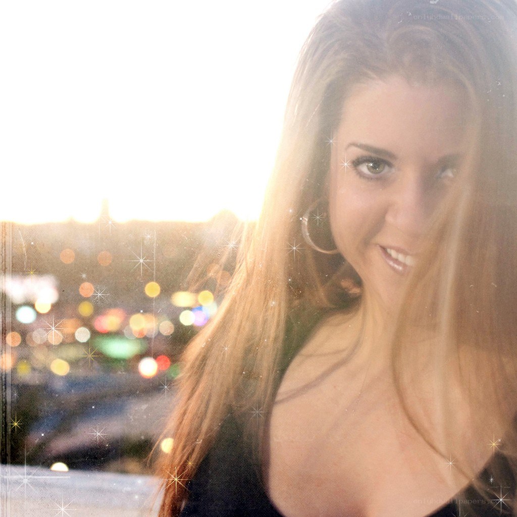 woman smiling at sunset