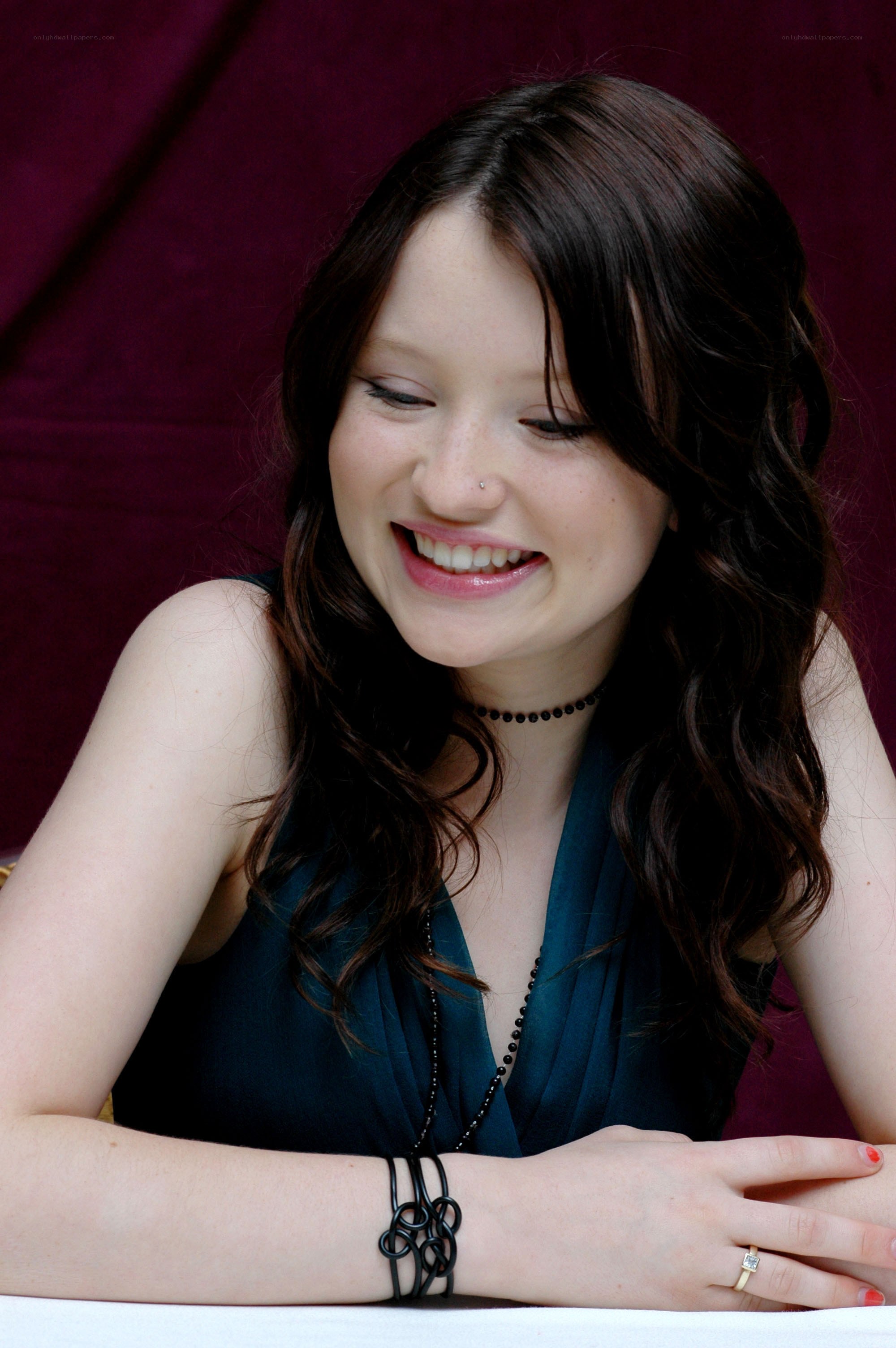 woman smiling at table