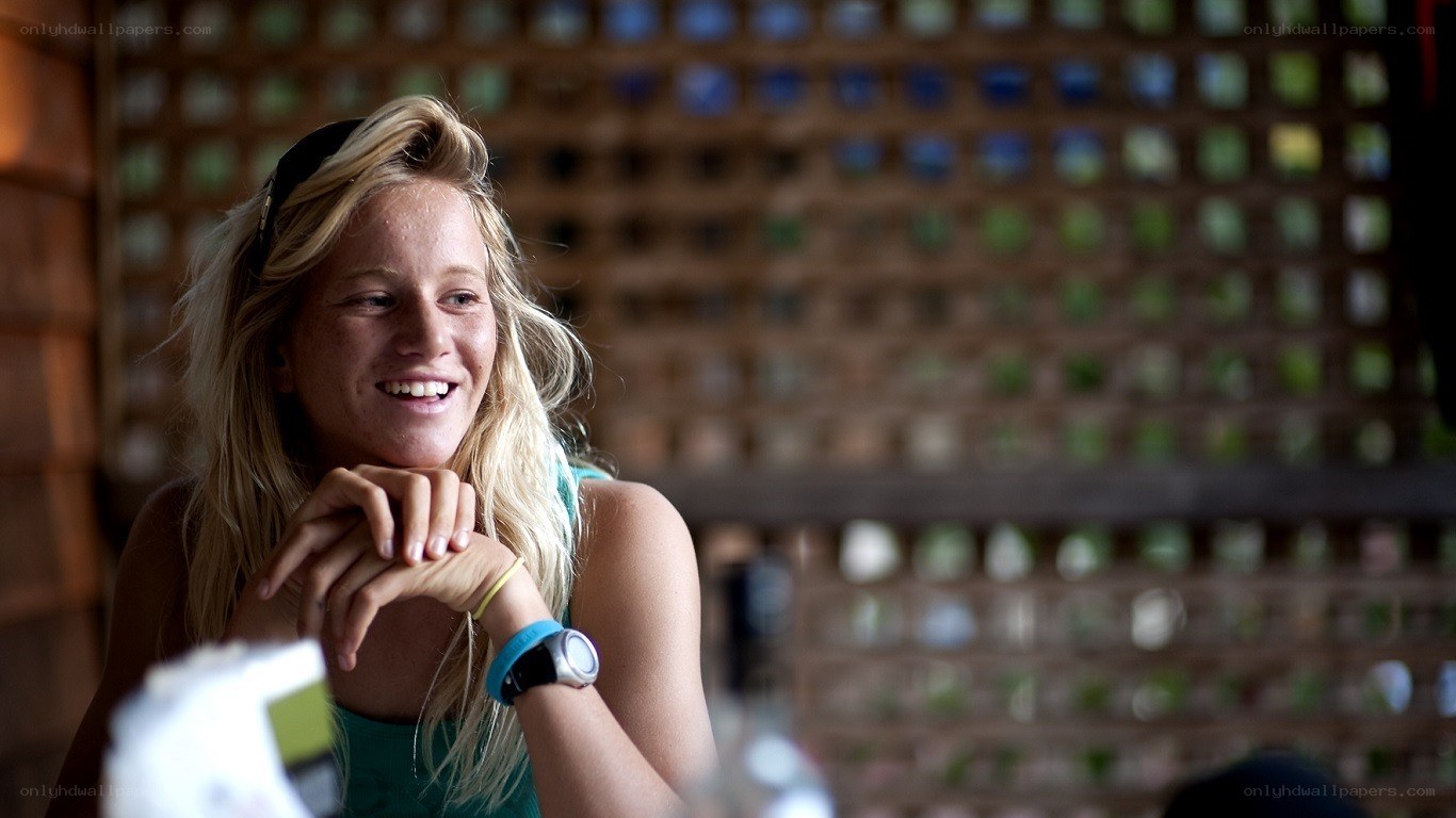 woman smiling at table