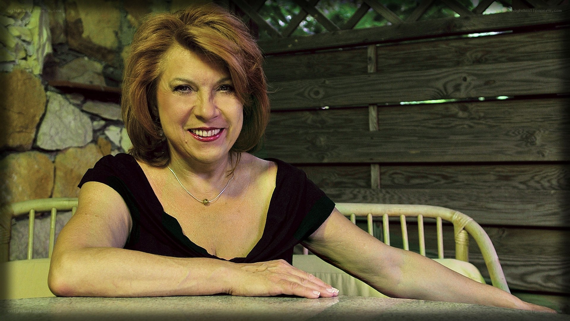 woman smiling at table