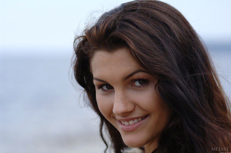 woman smiling at the beach