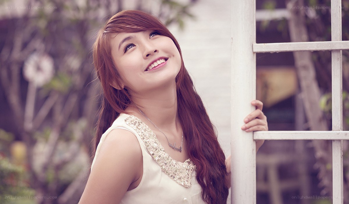 woman smiling at window