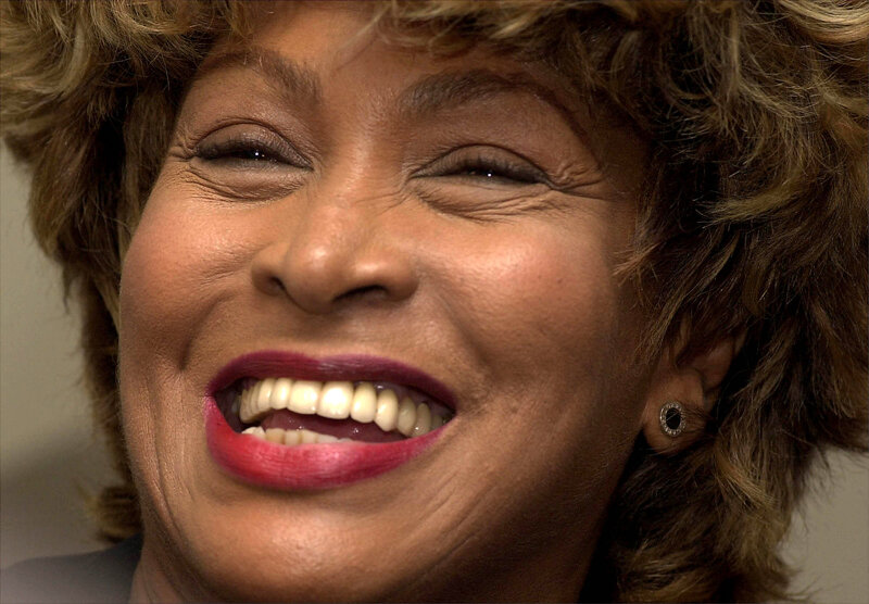woman smiling broadly