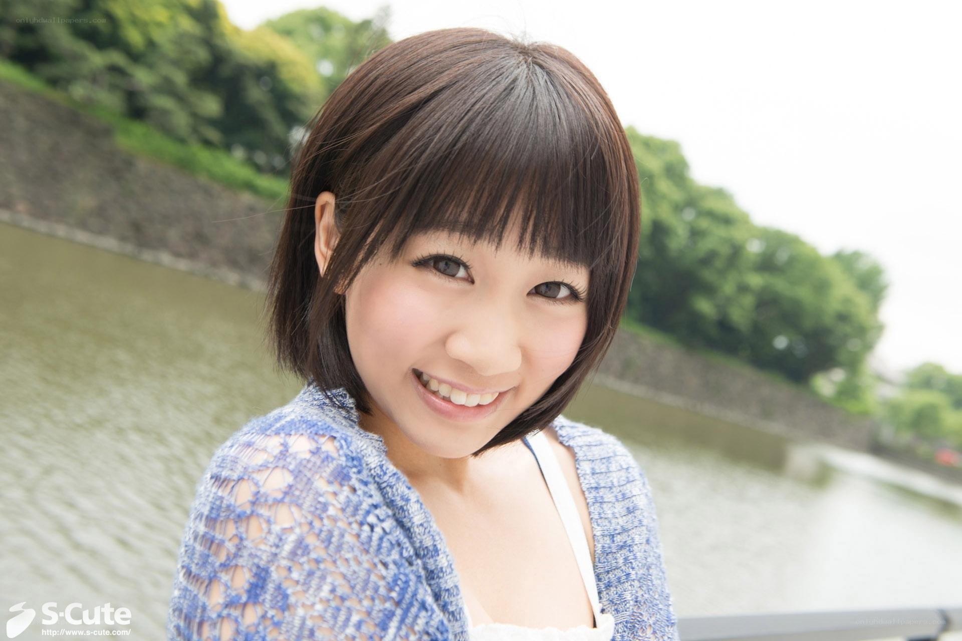 Woman smiling by a river