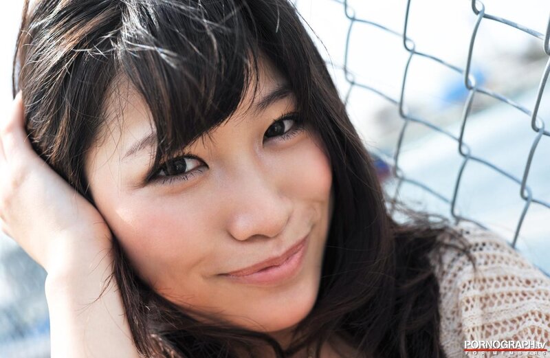 woman smiling by fence