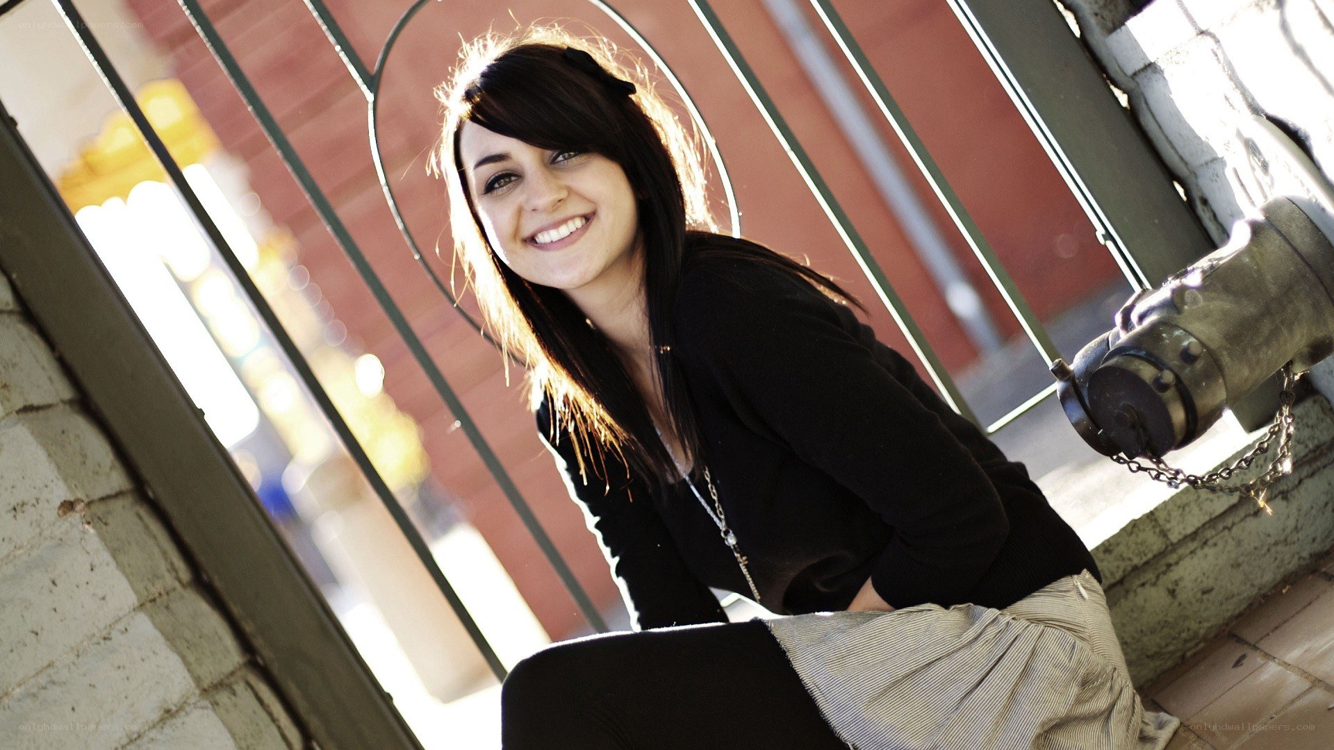 woman smiling by fire hydrant