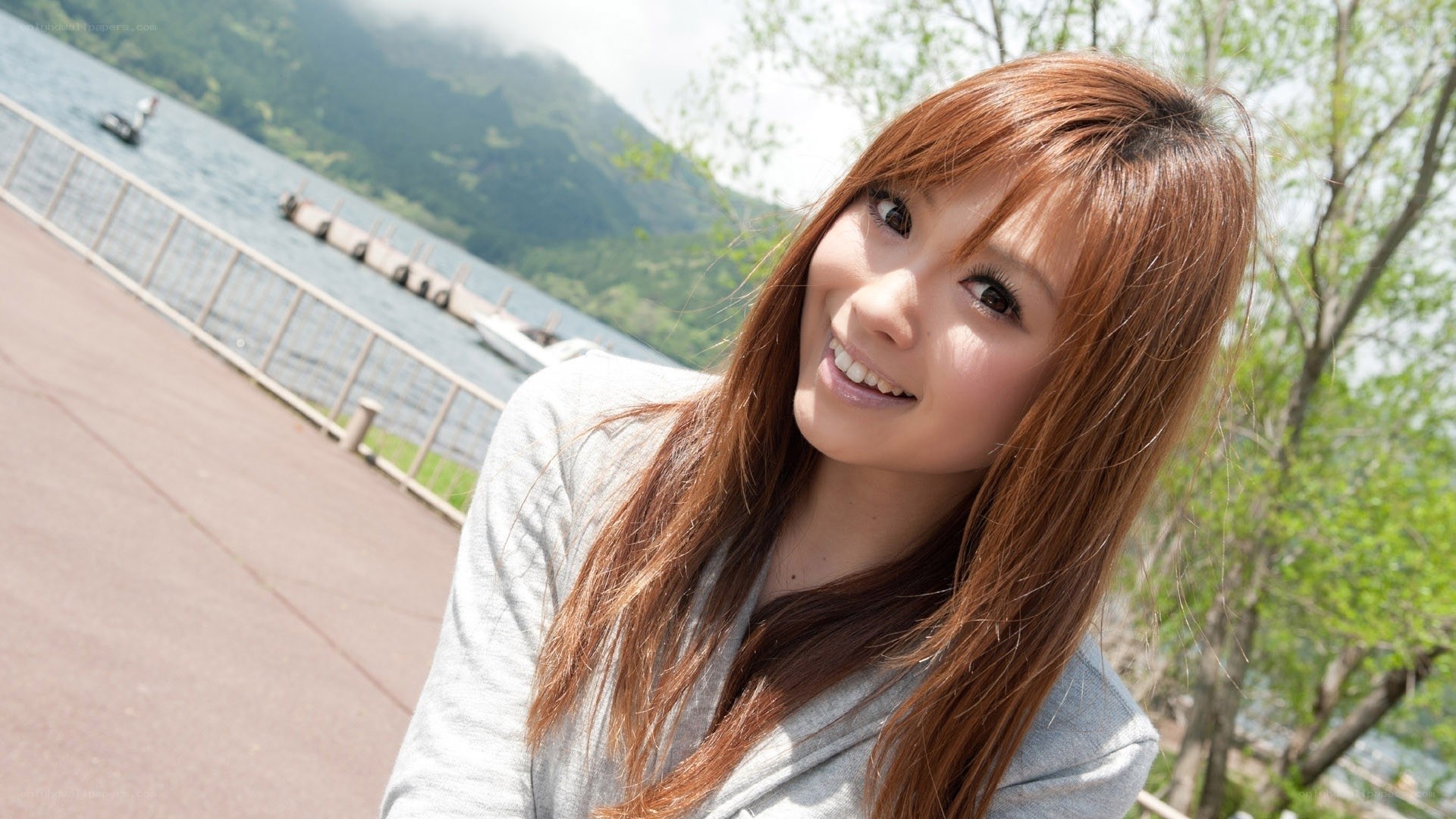 woman smiling by lake