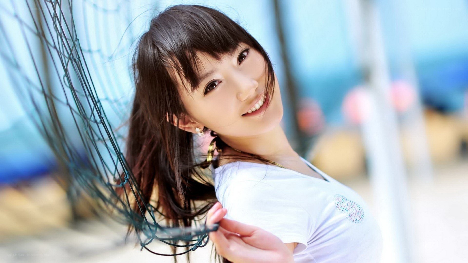woman smiling by net