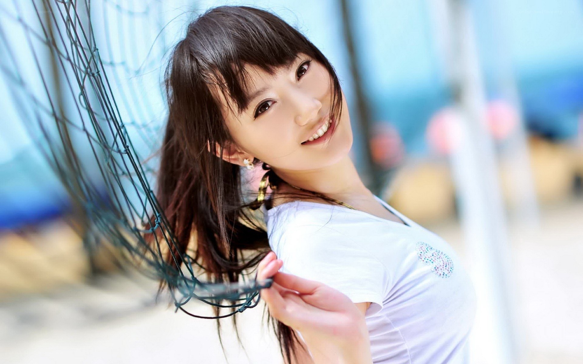 woman smiling by net