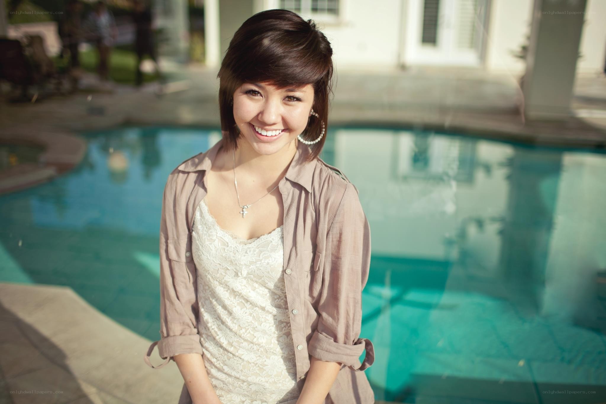 woman smiling by pool