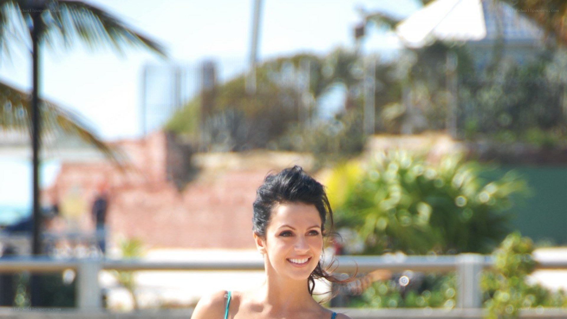 woman smiling by pool
