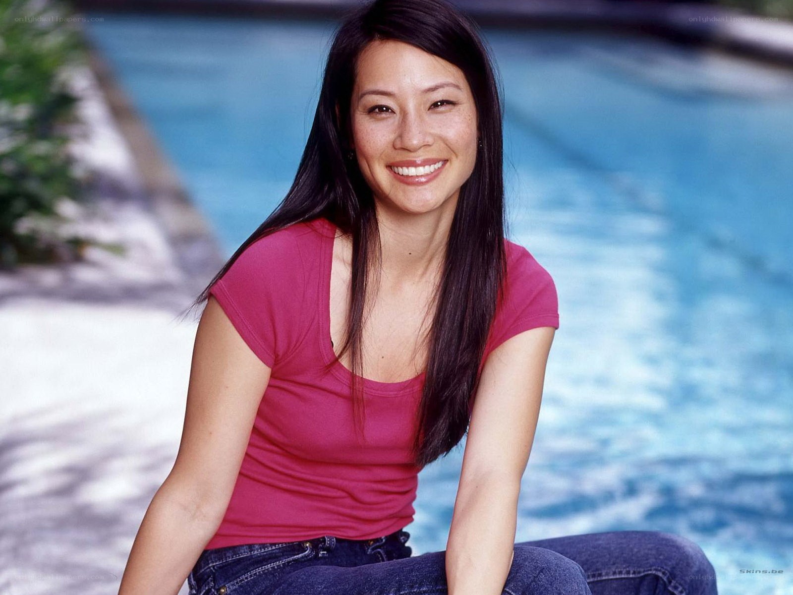 woman smiling by pool