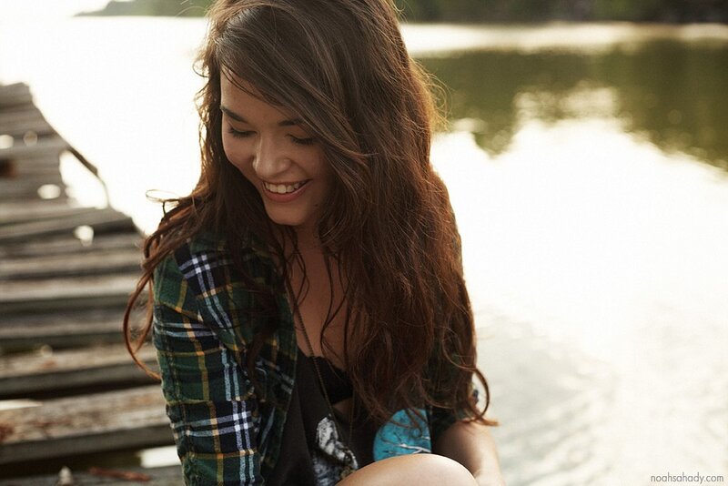 woman smiling by the lake