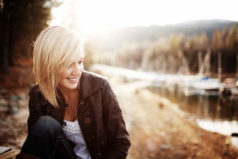 woman smiling by the lake