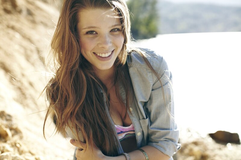 woman smiling by the lake