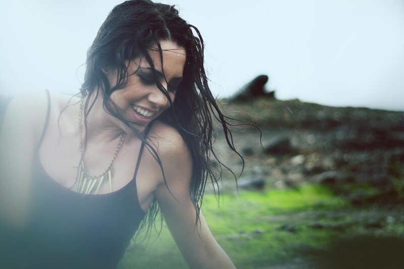 woman smiling by the sea