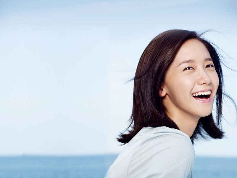 woman smiling by the sea