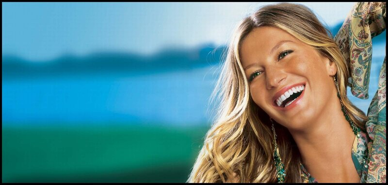 woman smiling by the water