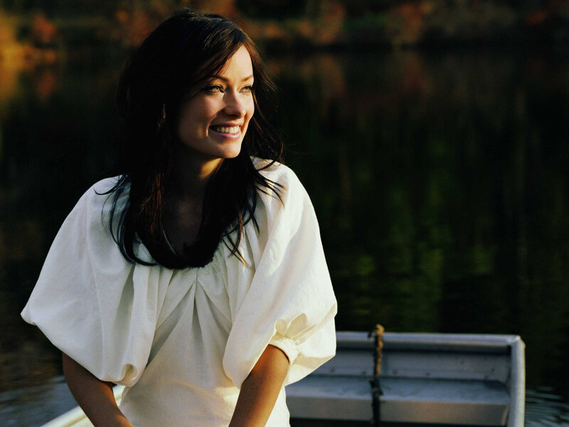 woman smiling by the water