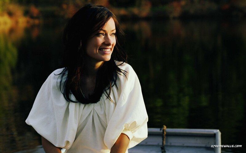 woman smiling by the water