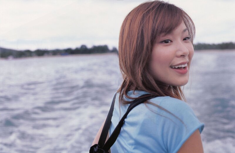 woman smiling by the water