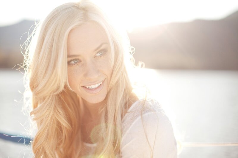 woman smiling by the water