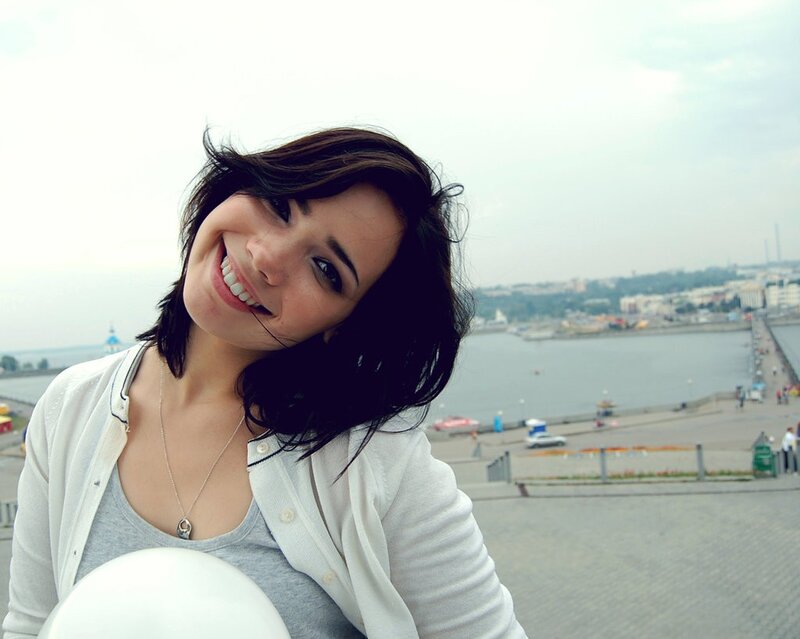 woman smiling by the water