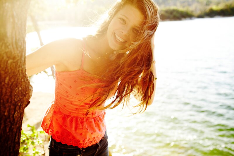 Woman smiling by the water