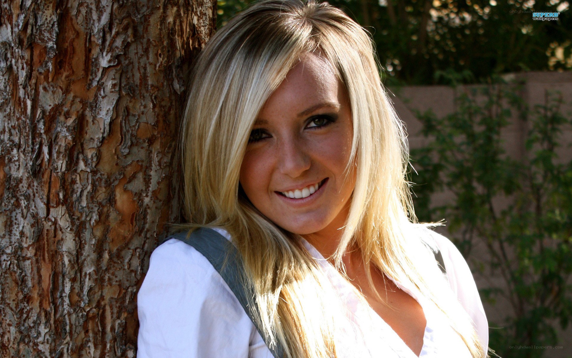 woman smiling by tree