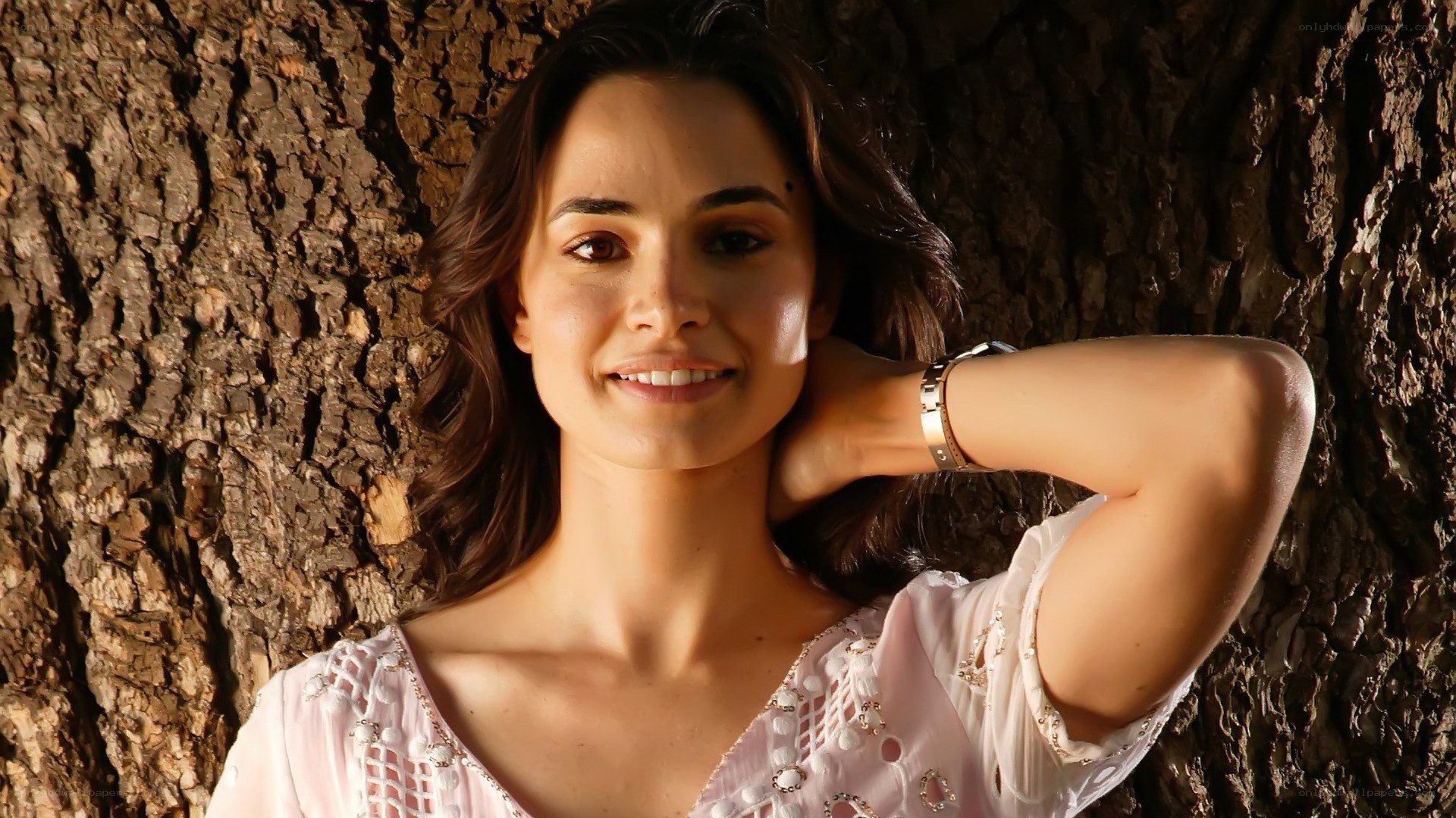 woman smiling by tree