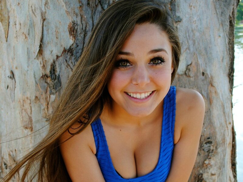 woman smiling by tree