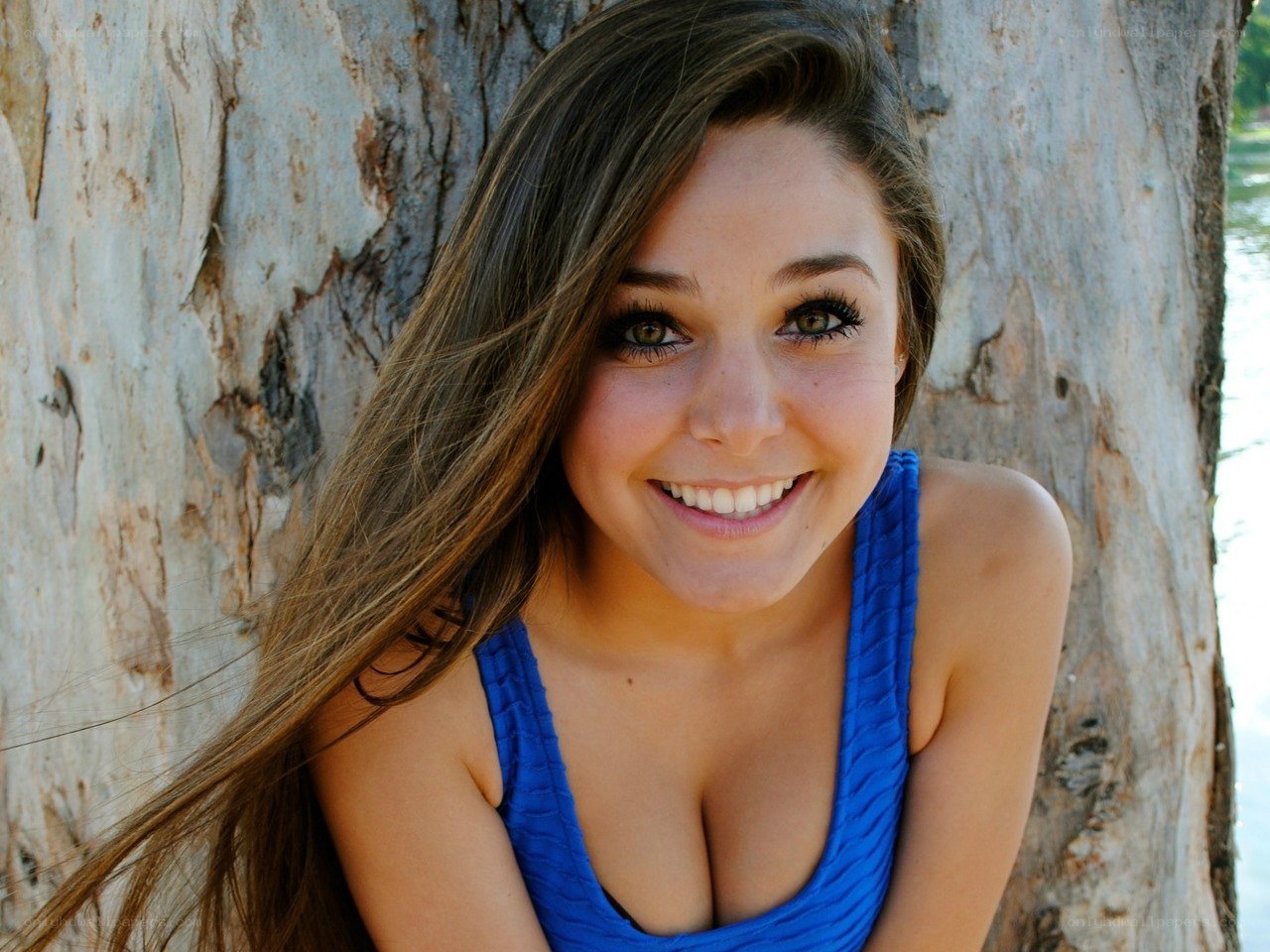 woman smiling by tree