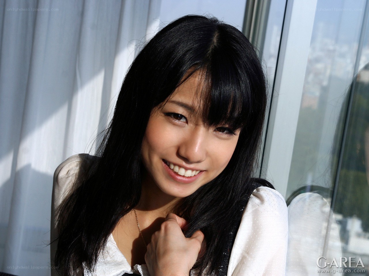 woman smiling by window