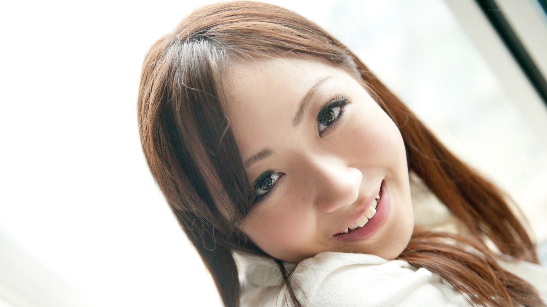 woman smiling by window
