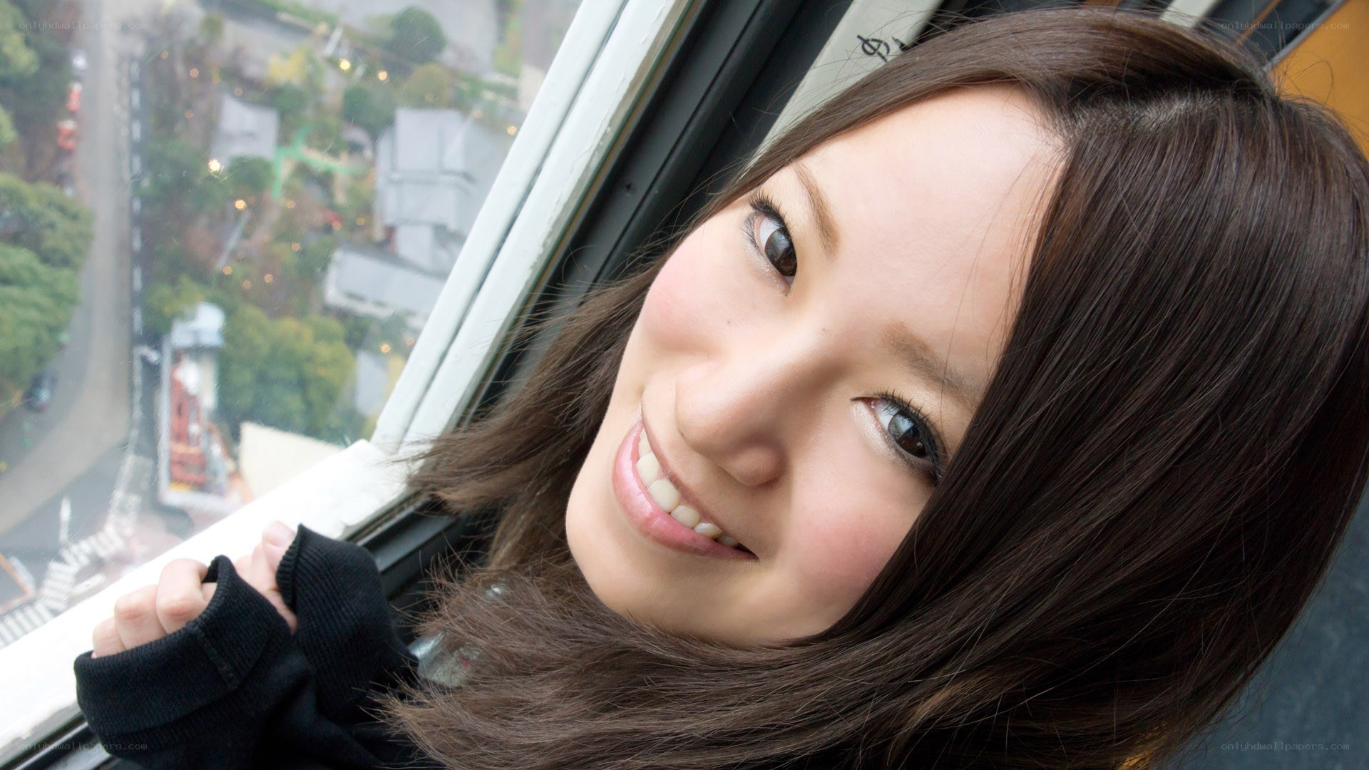 woman smiling by window