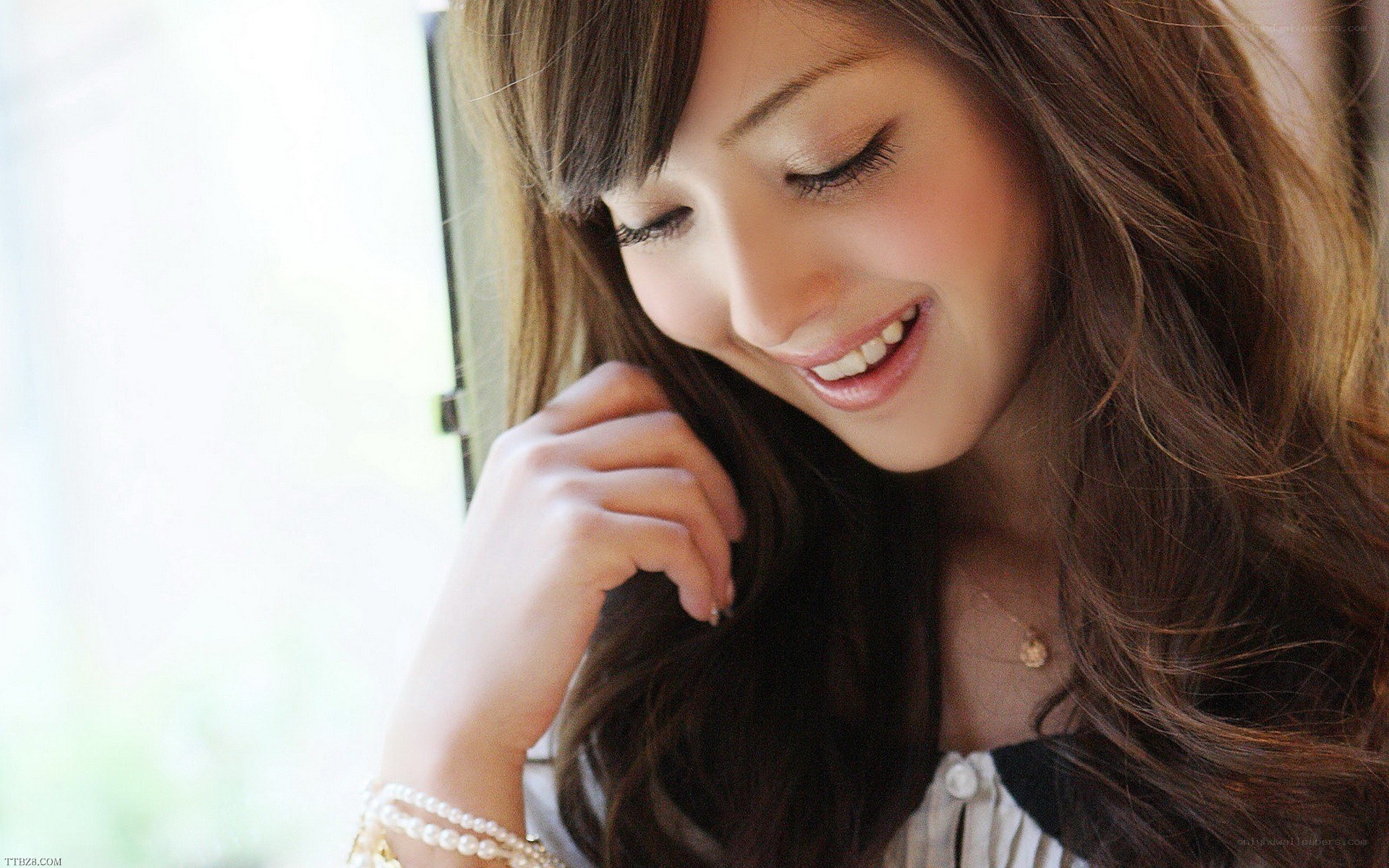 woman smiling by window