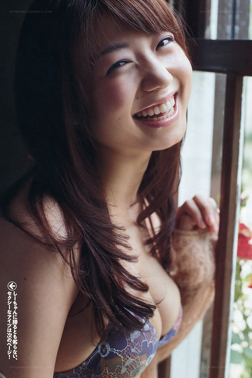 woman smiling by window