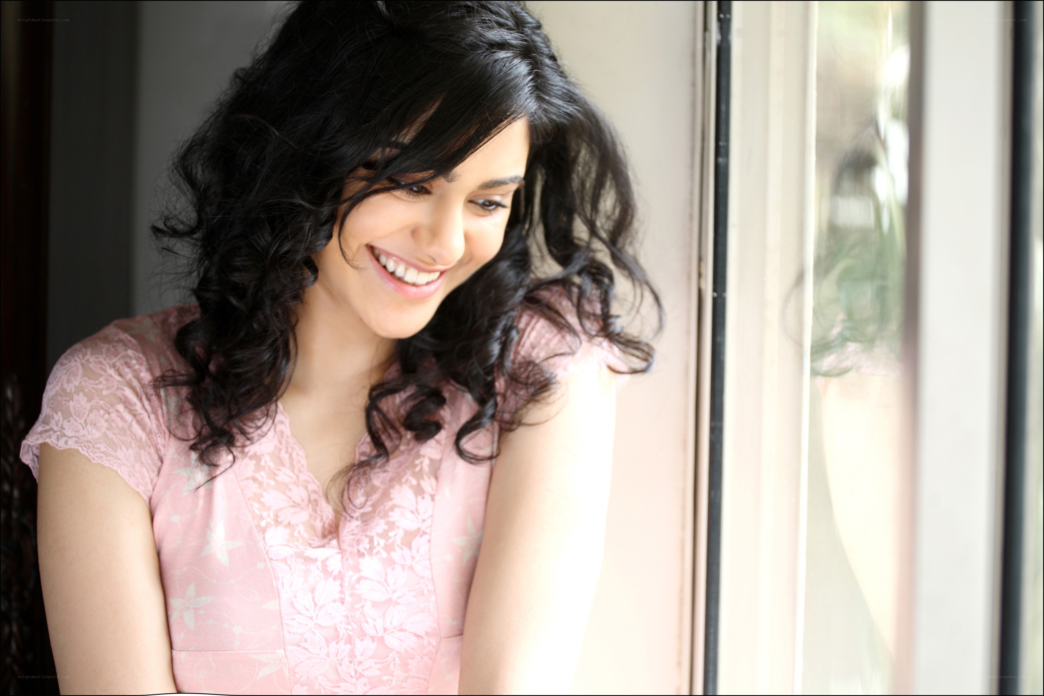 woman smiling by window