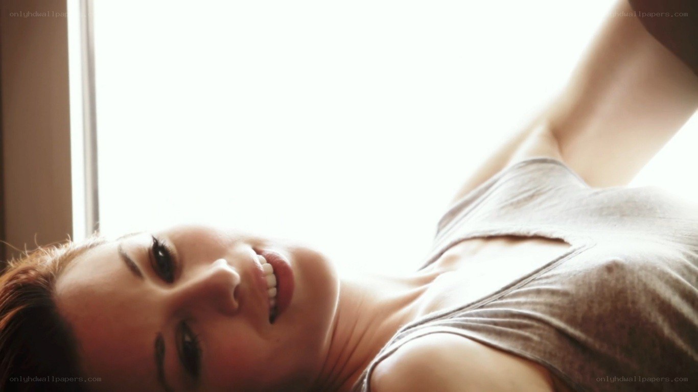 woman smiling by window