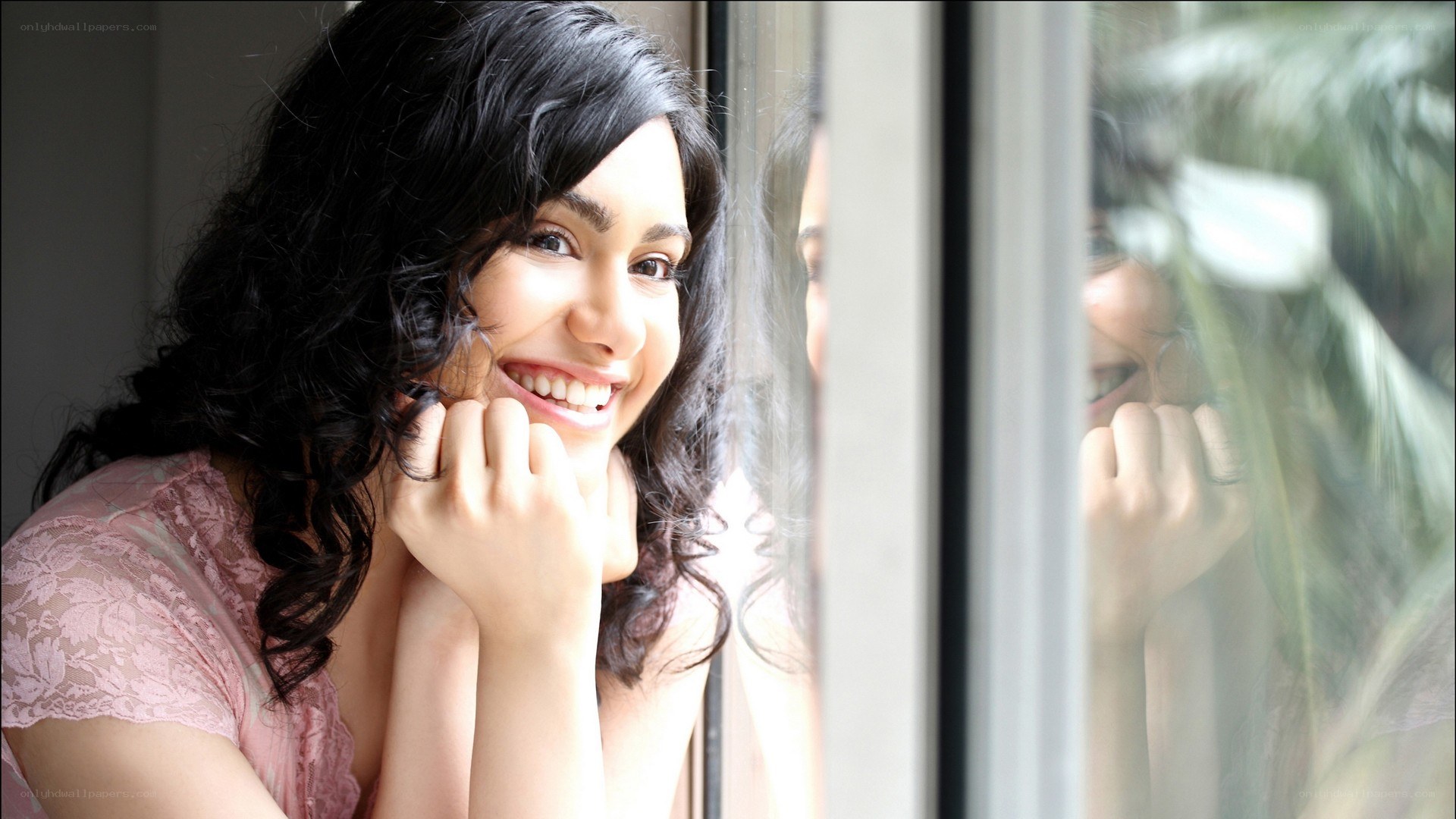 woman smiling by window