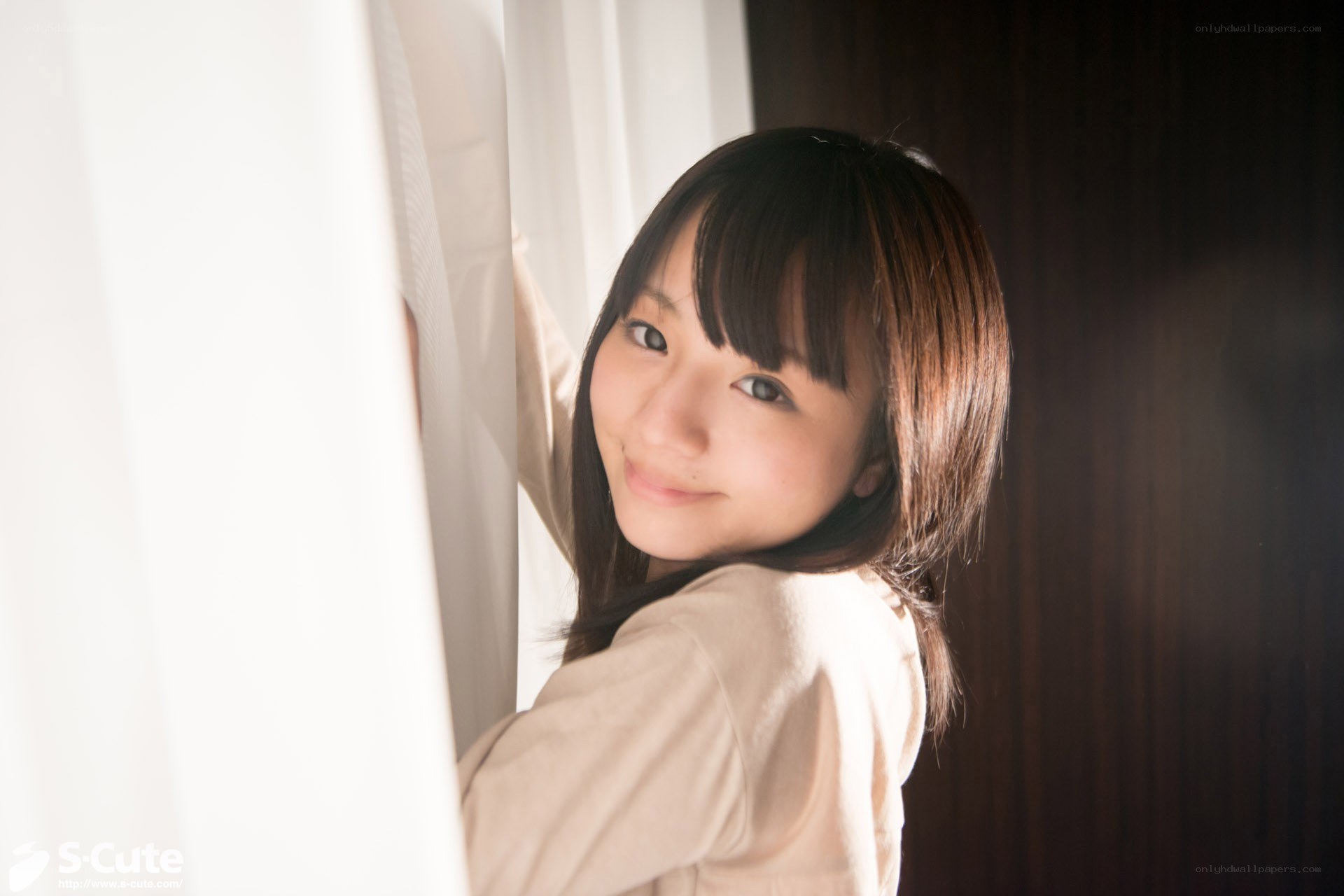 woman smiling by window