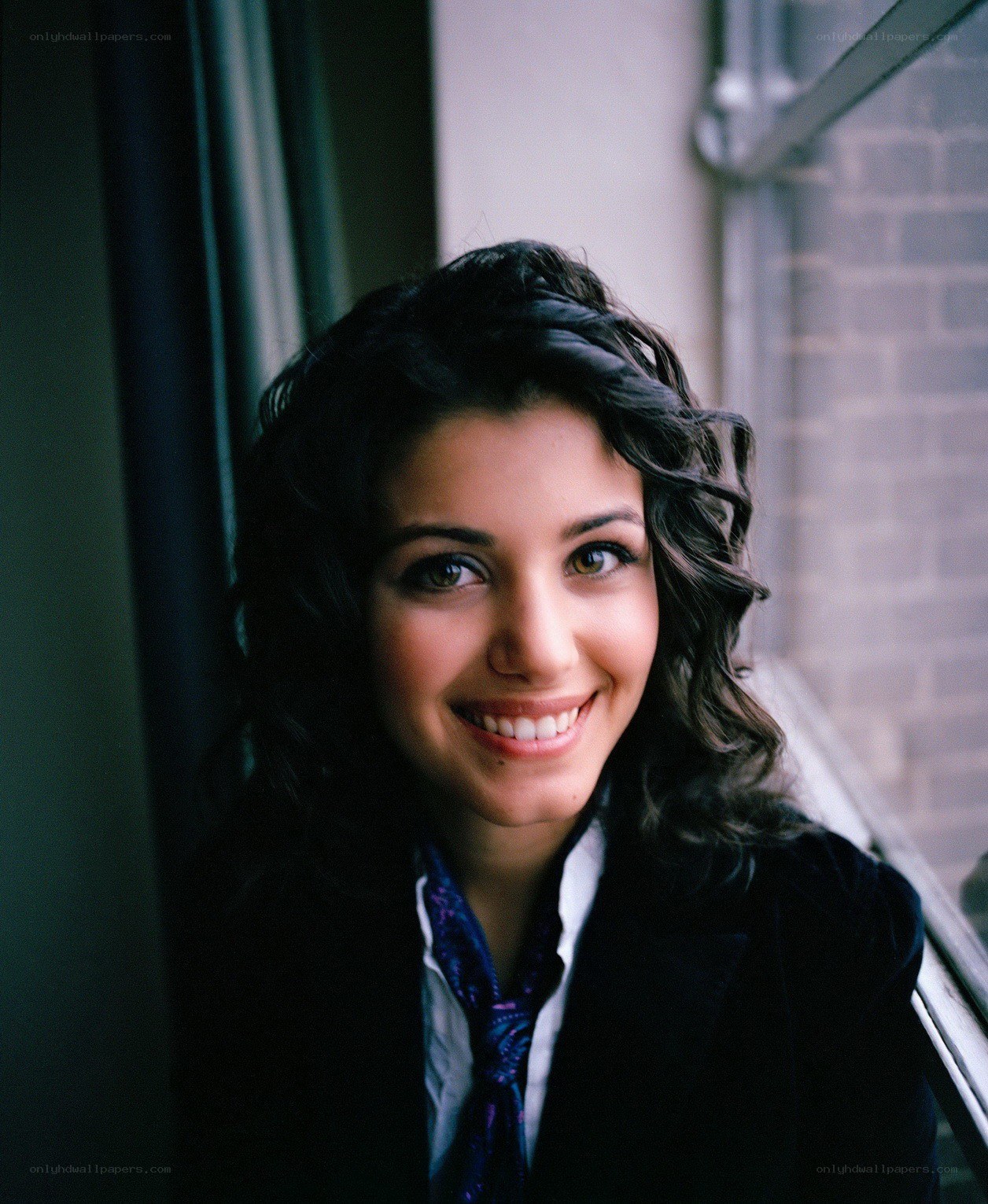 woman smiling by window