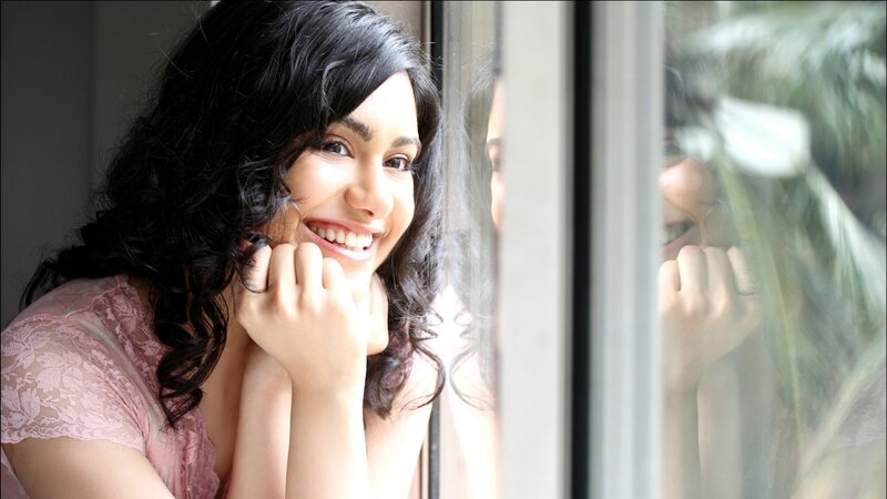 Woman Smiling by Window — Pink