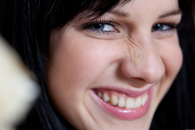 woman smiling closely