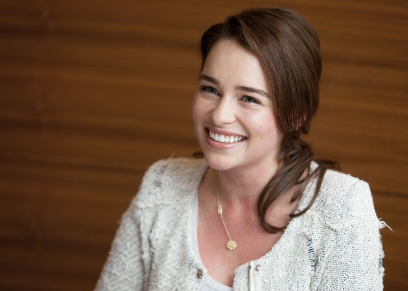woman smiling in a cardigan